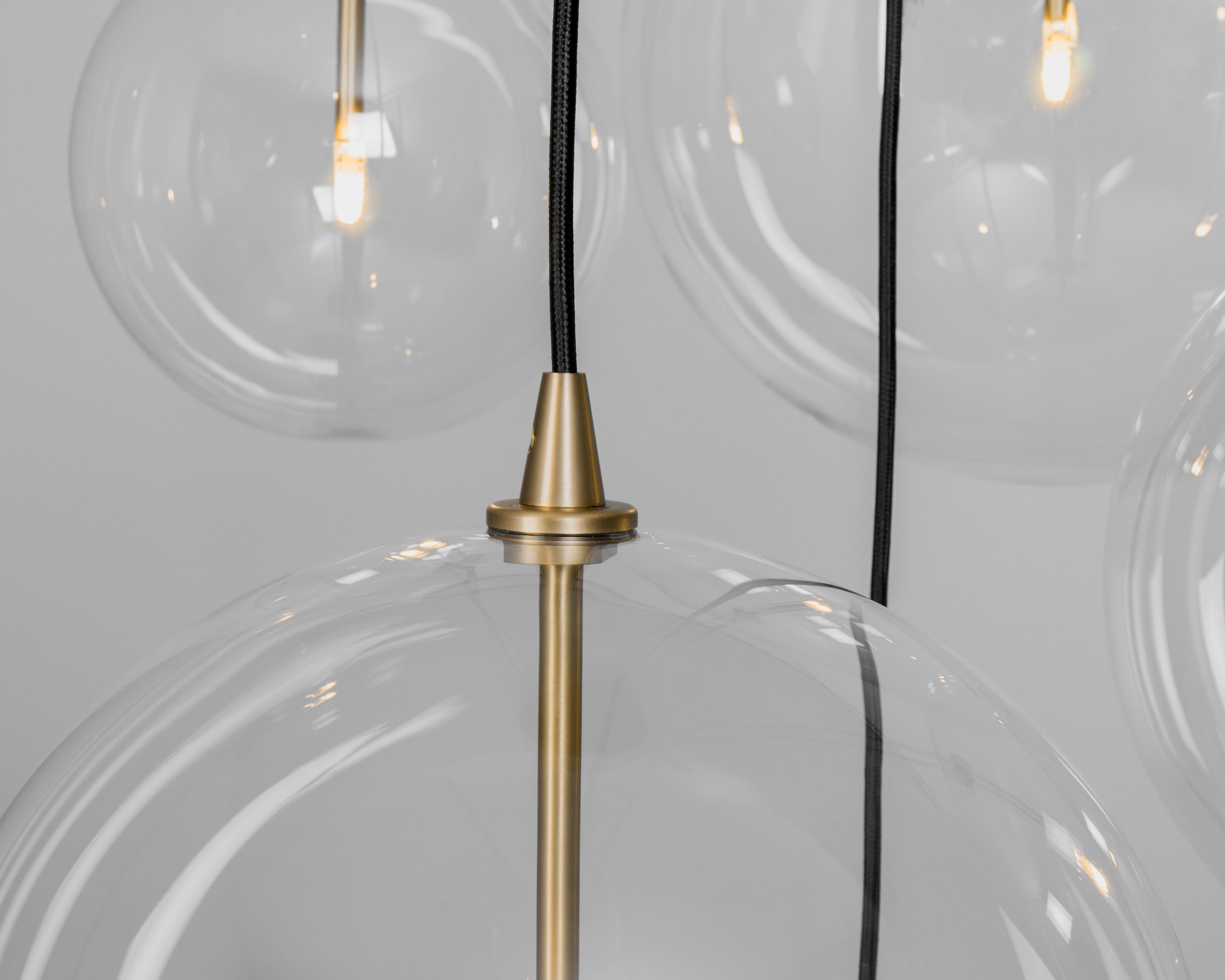 Schwung Cluster 5 Burnished Brass Transparent Globe Mix Chandelier